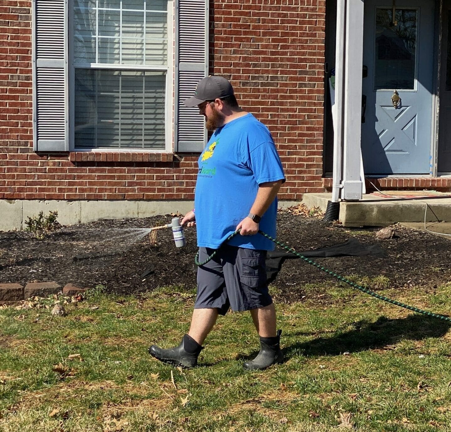 Northern Kentucky dog waste removal service applying yard deodorizer treatment